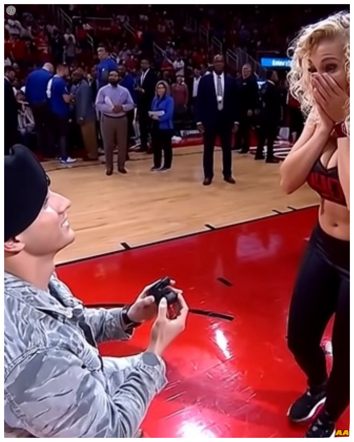 A Soldier’s Surprise Proposal at the Basketball Court The sun was setting over the basketball court, casting a warm glow on the scene as players finished their games and families gathered to enjoy the evening.  Among the crowd, a young woman named Emily sat on the bleachers, her heart heavy with longing for her boyfriend, Jake, who had been deployed for months. 💔  Every day felt incomplete without him, and she often found herself daydreaming about their future together.  Just as the last game ended, Emily noticed a figure in the distance, walking toward the court.  Her heart raced as she squinted, hoping it was him.  “Could it be?” she whispered to herself.  As he drew closer, she recognized the familiar military uniform that had become so dear to her heart.  “Jake!” she exclaimed, jumping to her feet.  He smiled widely, his eyes filled with love and excitement.  “Surprise, Em!” he called out, rushing toward her.  In an instant, they were in each other’s arms, tears of joy streaming down Emily’s cheeks. 😭  “I can’t believe you’re here!” she cried, holding him tightly.  “I couldn’t wait any longer. I missed you too much,” Jake replied, his voice warm and reassuring.  After a heartfelt embrace, they took a moment to catch their breath, surrounded by the fading light of the day.  “Let’s celebrate your return!” Emily suggested, her heart soaring.  But Jake had something special planned.  As they walked hand in hand to the center of the court, he turned to her, his expression serious yet filled with warmth.  “Emily, these past months have shown me just how much you mean to me,” he began, his voice steady.  “I can’t imagine my life without you. You’re my everything.”  With that, he reached into his pocket and pulled out a small velvet box, kneeling down on one knee.  “Will you marry me?” he asked, his eyes shining with love. 💍  Time seemed to stand still as Emily gasped, her heart racing.  “Yes! Yes, a thousand times yes!” she shouted, tears of joy spilling down her cheeks.  Jake slipped the ring onto her finger, and they embraced once more, enveloped in a moment of pure happiness.  The other players and families around them erupted in cheers, celebrating the beautiful moment.  As they stood together, surrounded by love and laughter, they knew that this was just the beginning of their journey together.  What adventures awaited them as they embarked on this new chapter in their lives?  The answers hung in the air, waiting for them to discover.  To be continued...  Click the link to read more 👇